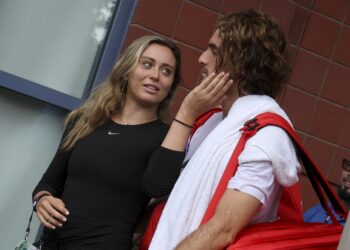 Pictured: Around team and family, Stefanos Tsitsipas and his girlfriend Paula Badosa are beaming as they enjoy an Italian dinner date.